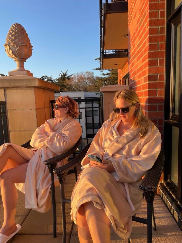 me and my sister in the hotel's spa robes on the balcony